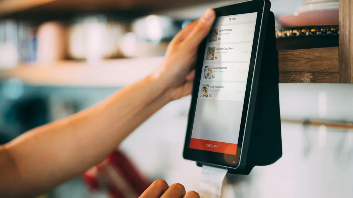 A sales manager reviewing a visual deal pipeline on a desktop monitor (Photo by iMin Technology, Pexels)