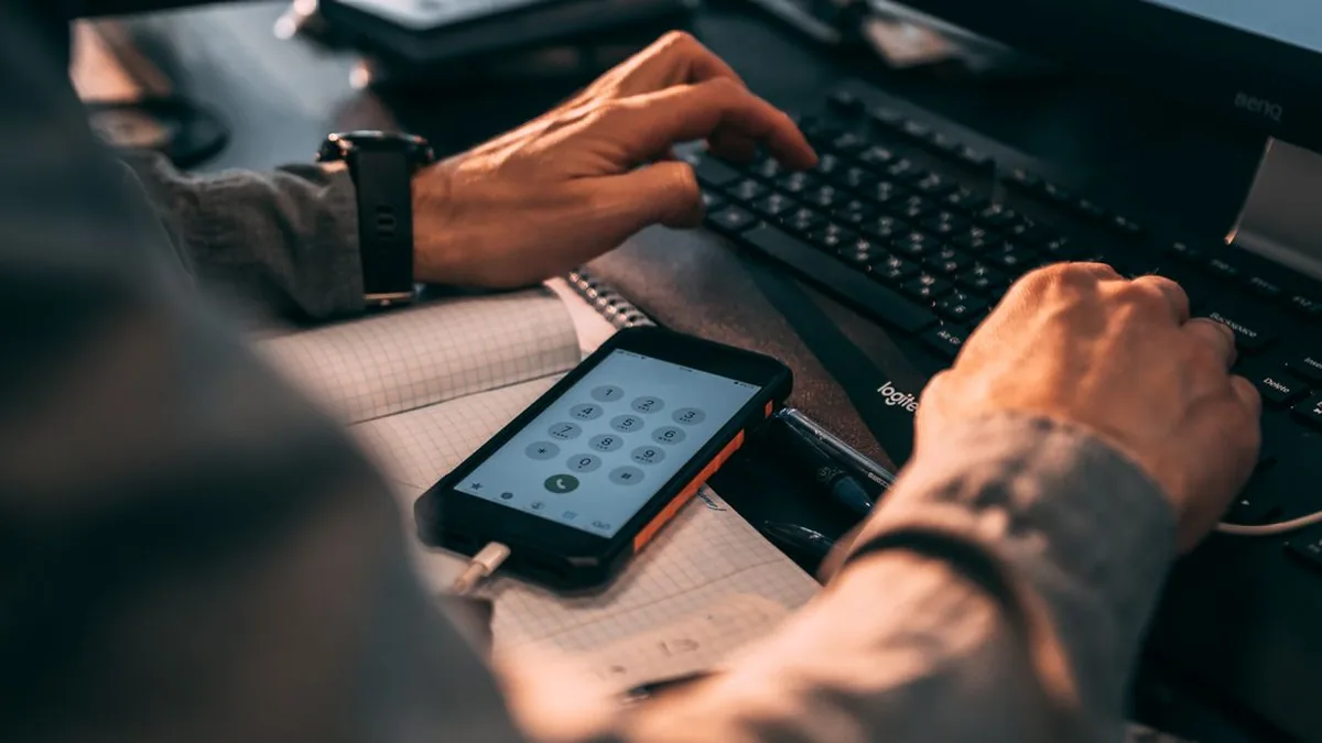 A laptop displaying a spreadsheet with a clearly visible phone-number column (Photo by Roman Koval, Pexels)