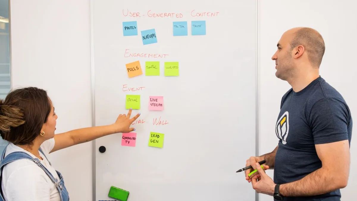 A cross-functional team choosing a workflow structure during a planning workshop (Photo by Walls.io, Pexels)