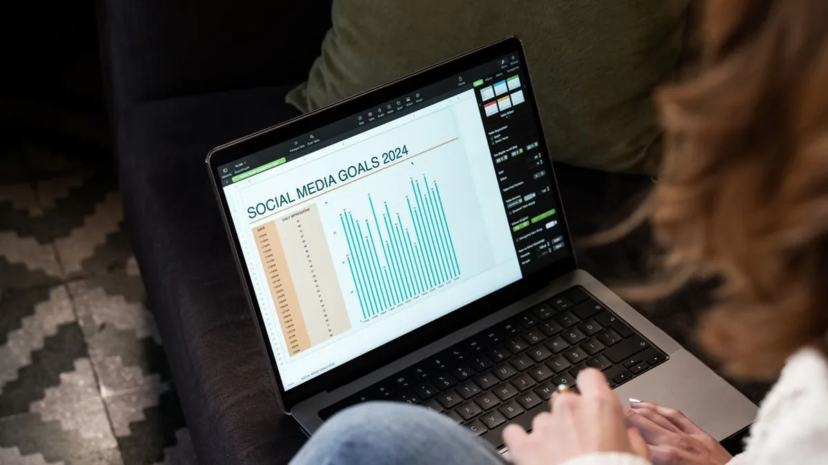 A laptop displaying a clean multi-channel social media scheduling dashboard on a desk (Photo by Ahmed ؜, Pexels)