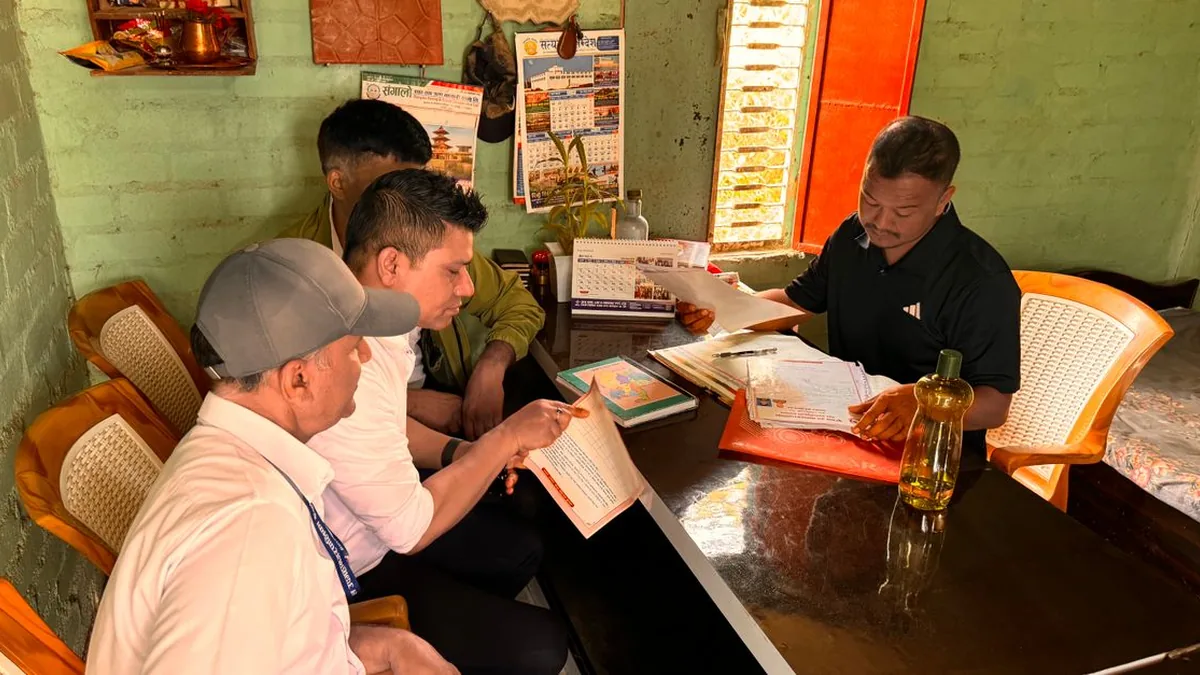 A small marketing team reviewing scheduled posts and approvals around a shared screen (Photo by CP Khanal, Pexels)