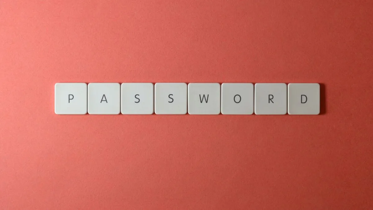 A professional enabling two-factor authentication while using a smartphone and laptop (Photo by Miguel Á. Padriñán, Pexels)