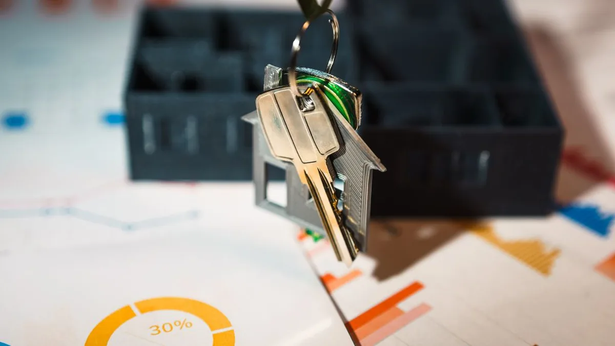 A mortgage team reviewing funnel and funded-loan metrics on a shared screen (Photo by Jakub Zerdzicki, Pexels)