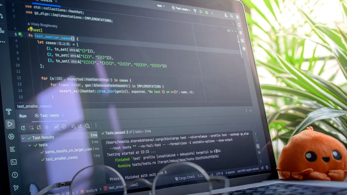 A QA engineer reviewing automated browser-test results and failure traces on a widescreen monitor (Photo by Daniil Komov, Pexels)