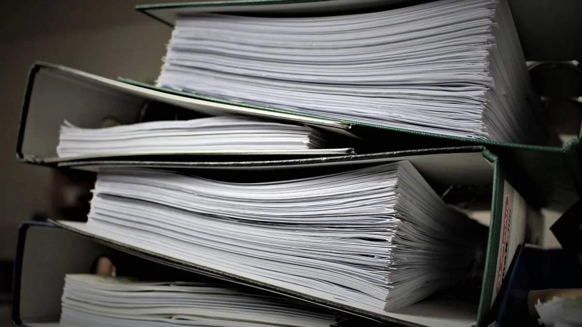 Organized business documents and digital knowledge resources prepared for an AI assistant (Photo by Pixabay, Pexels)
