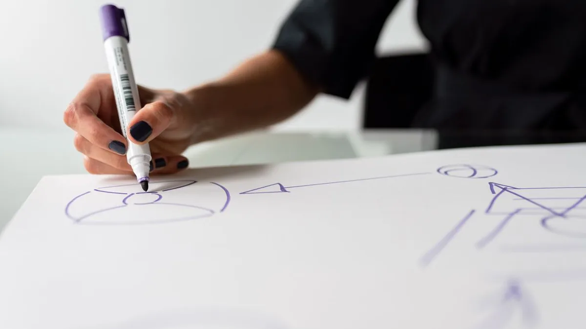 A non-technical business user arranging connected steps in a visual no-code flow builder (Photo by ThisIsEngineering, Pexels)