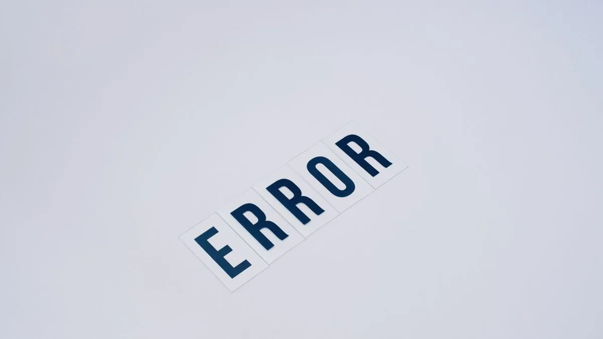 A CRM administrator diagnosing a failed automation run using logs and error alerts (Photo by Vie Studio, Pexels)