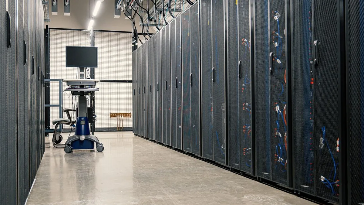 A security professional reviewing access controls and customer-data safeguards on a workstation (Photo by Brett Sayles, Pexels)