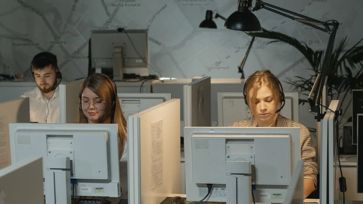 A support agent reviewing customer tickets in a helpdesk workspace (Photo by Tima Miroshnichenko, Pexels)