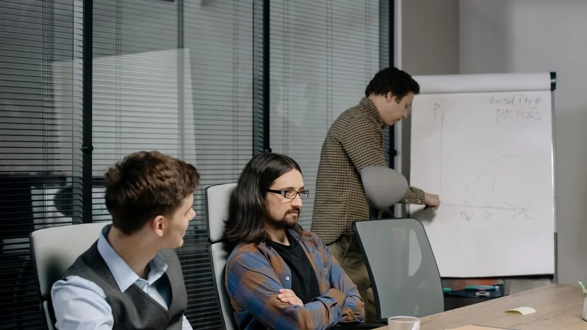 An agency team reviewing an AI-generated brief beside the original project notes.