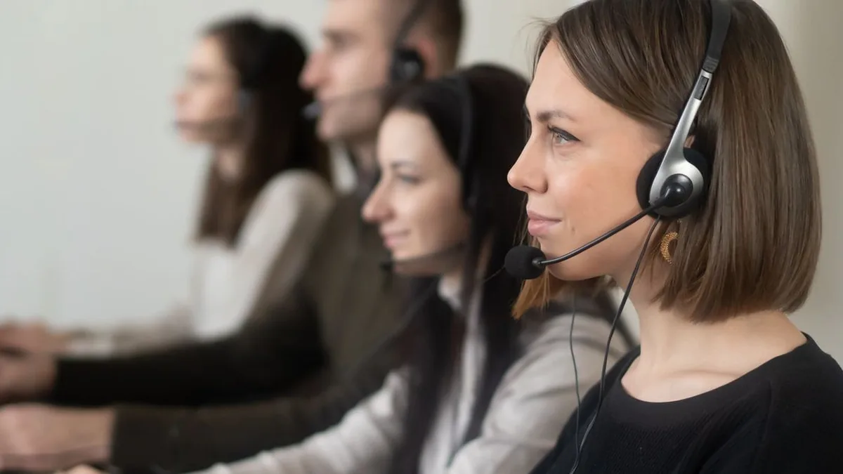A small customer support team manages mobile messages together at a shared workstation (Photo by Ksenia Kartasheva, Pexels)