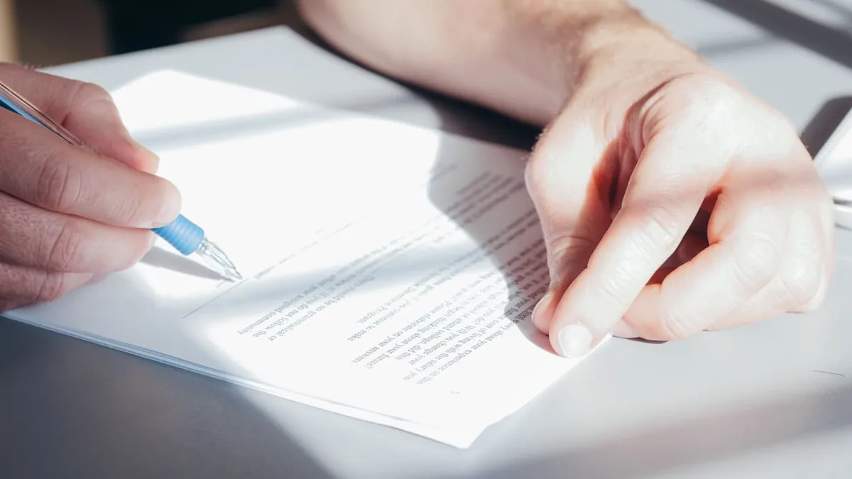 A person reviewing consent and communication preferences on a tablet (Photo by Kindel Media, Pexels)