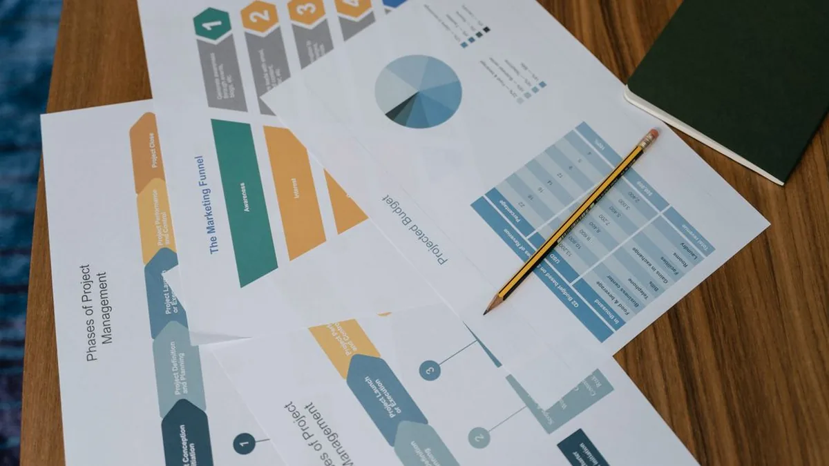 A marketer reviewing a visual messaging workflow beside CRM campaign notes on a laptop (Photo by MART  PRODUCTION, Pexels)