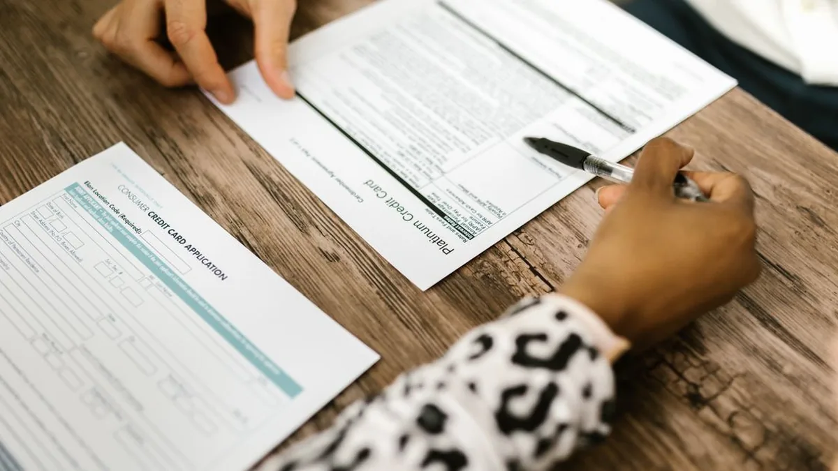 A creative team reviewing a design proof with visible comments and an approval checklist.