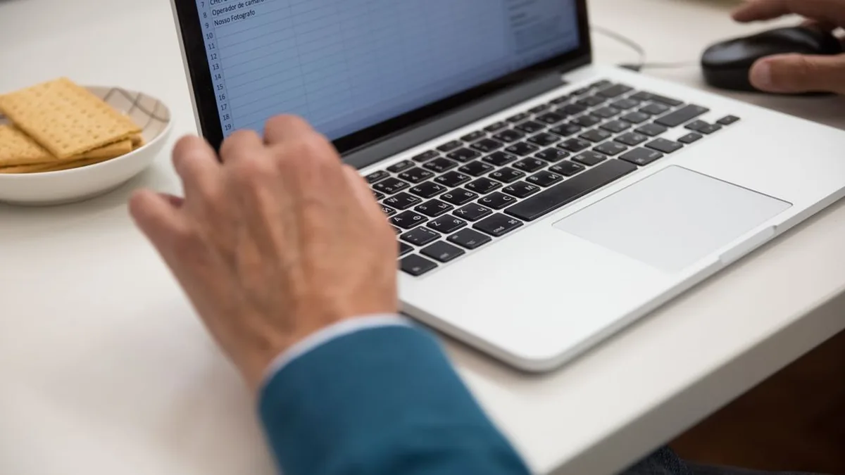 A close view of spreadsheet cells using simple status and priority dropdown controls (Photo by Kampus Production, Pexels)