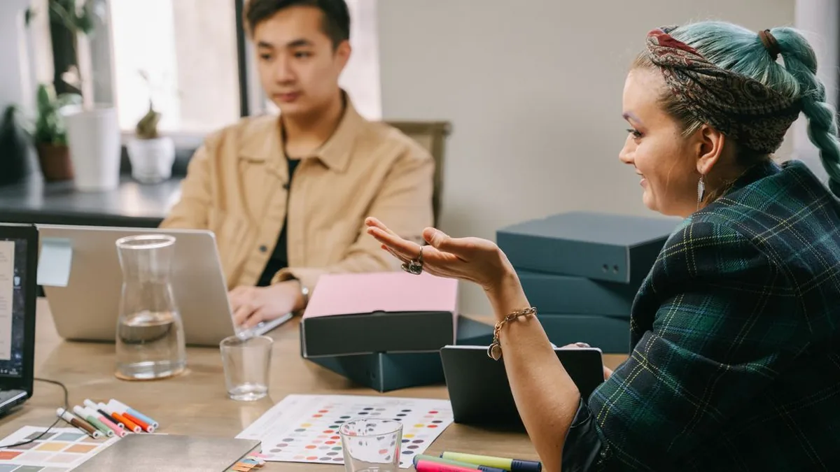 An agency team reviewing a new client's account setup and onboarding checklist together (Photo by Ivan S, Pexels)