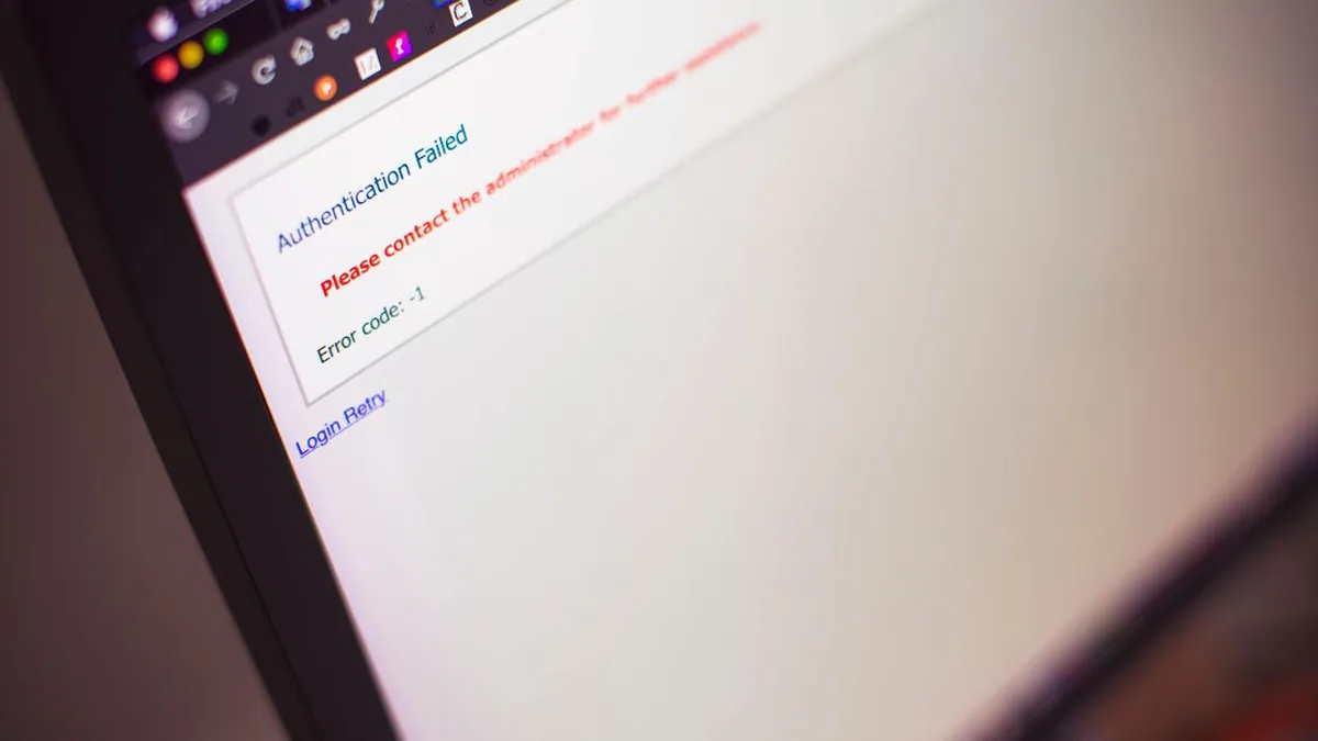 An operations specialist checking workflow alerts and failed-run logs on a monitor (Photo by Markus Spiske, Pexels)