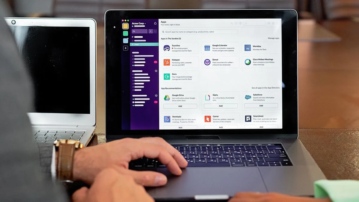 A workstation showing several business applications connected through one automation workflow (Photo by Mikhail Nilov, Pexels)