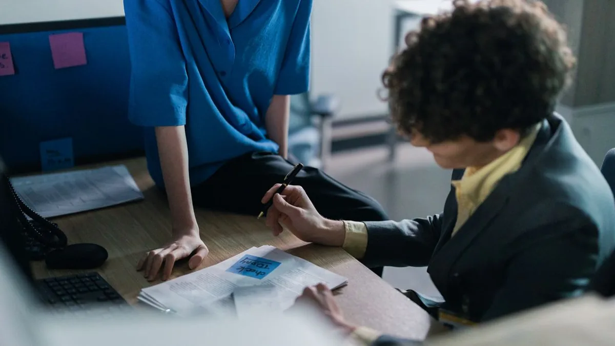 An employee checks an AI answer against linked workplace documents on a laptop (Photo by cottonbro studio, Pexels)