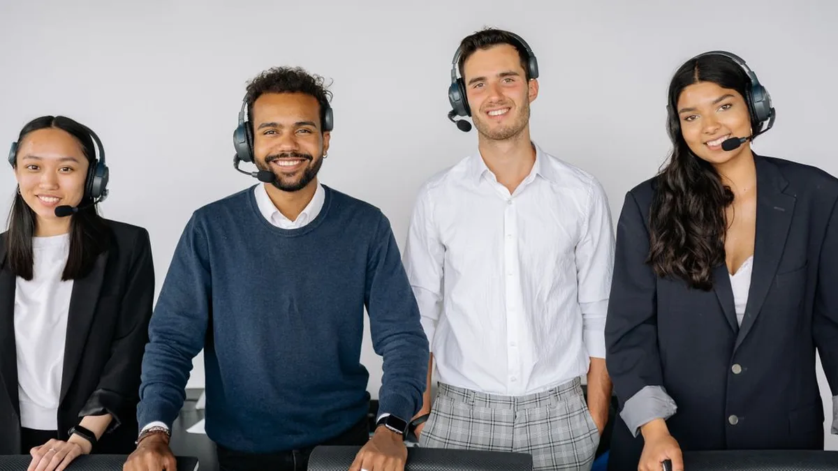 A small customer support team responding to mobile messaging conversations from a shared workspace (Photo by Yan Krukau, Pexels)