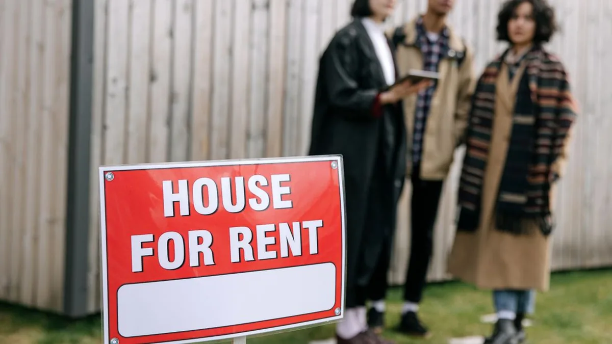 A landlord reviewing applicant verification and screening results without exposing personal document details (Photo by Ivan S, Pexels)